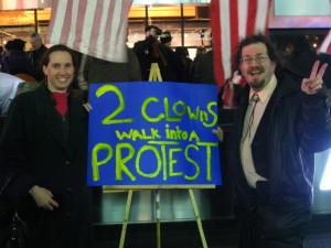 The authors with an Occupy Broadway protest sign